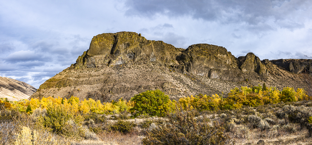 A view of a Basalt bluff and Fall colors off Hiway 12 in Eastern Washington