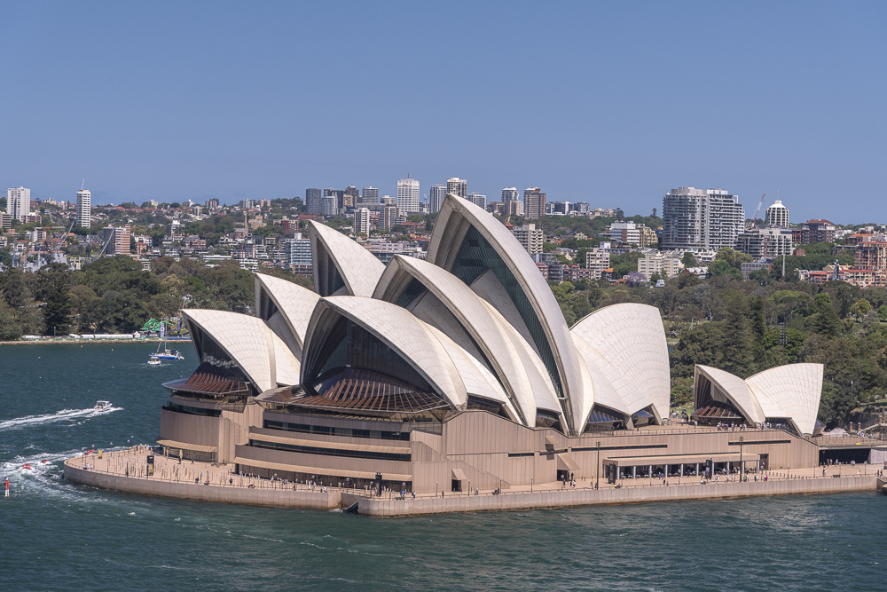 The architecturally beautiful Sydney Opera House and Concert Hall as seeen from the Sydney Harbour Bridge