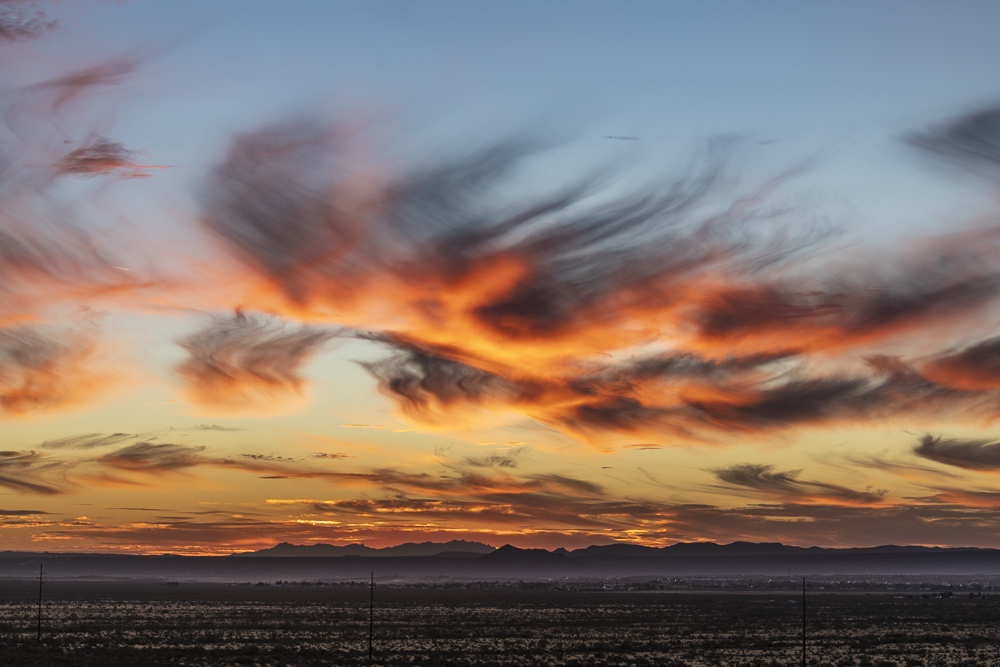 A sunset near Las Cruces New Mexico with cirrus clouds showing Virga effect.