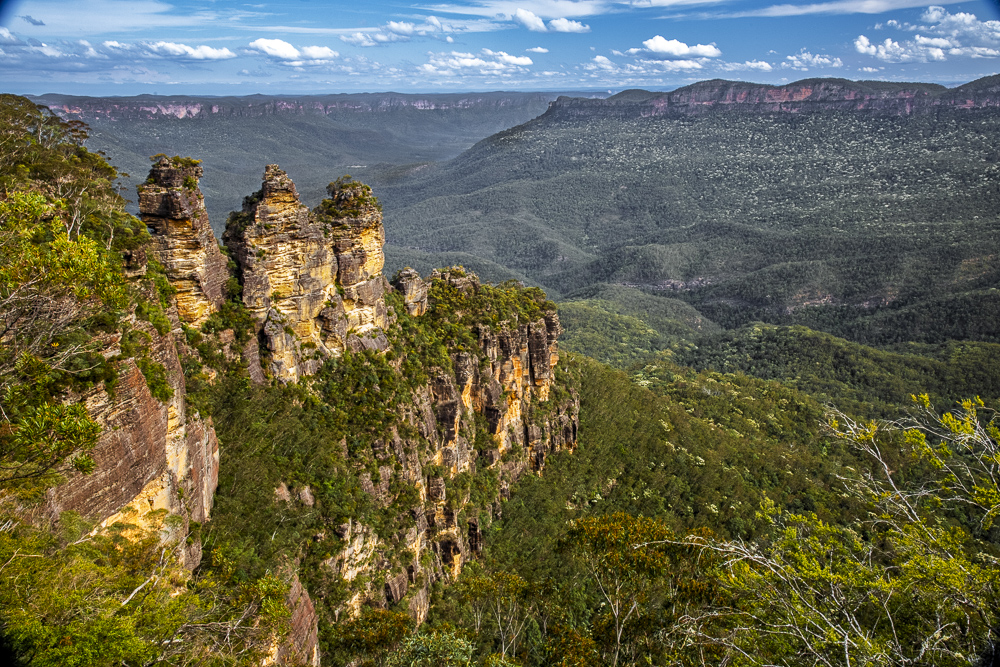 The geologic rock columns, called Three Sisters, as seen from the Three Sisters Walk and Echo Point in the Blue Mountains near Katoomba, New South Wales, Australia