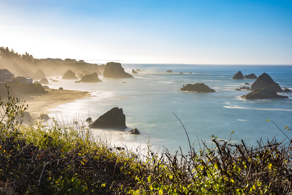 Morning haze rising from Harris Beach near Brookings Oregon.  The Haystack Rocks add to the views looing out at the Pacific Ocean