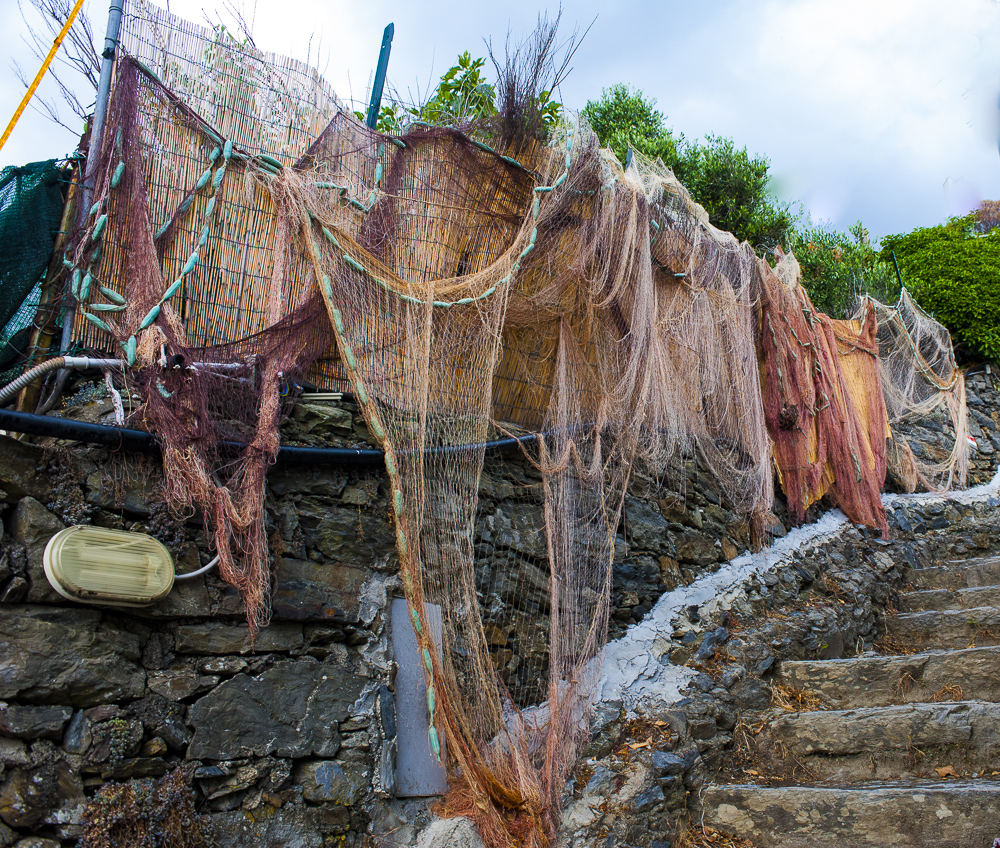 Fishing net hung on wall, Vernazza, Italy