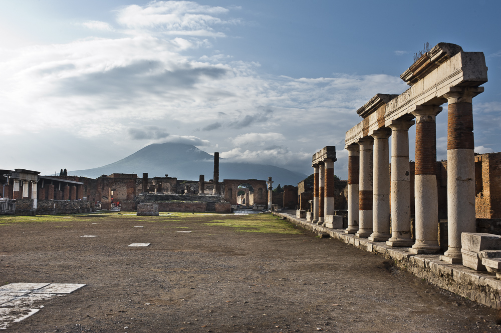 A large piazza and Columns of ancient Pompei with Mt. Vesuvius in the background, Pompei Italy