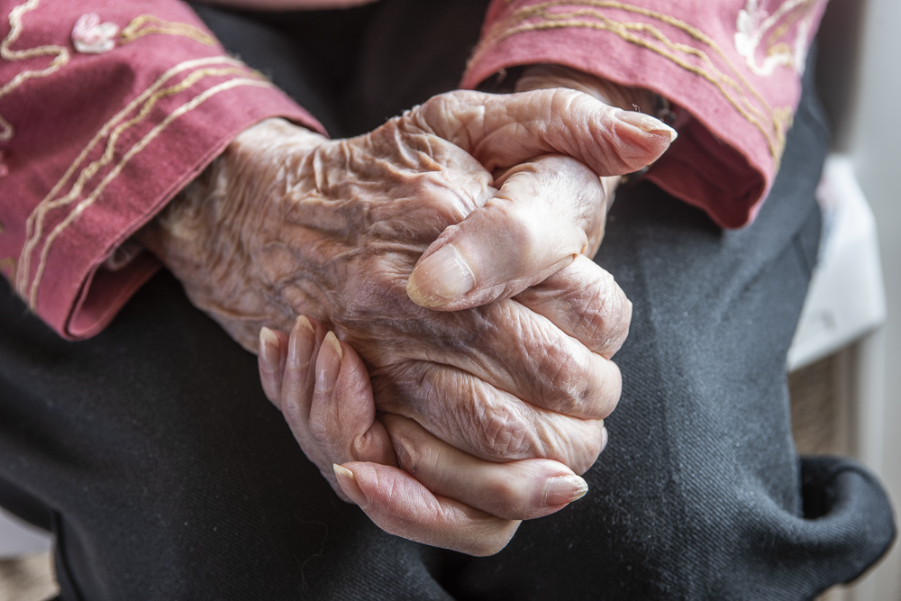 Senior Woman's hands in thoughtful repose.