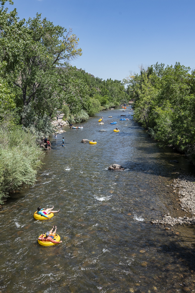Tubers enjoying a cool float down Clear Creek in Golden, Colorado