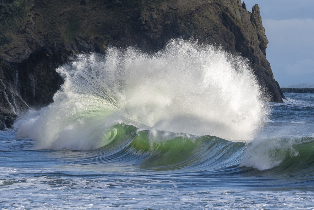Crashing waves against the cliffs at Waikiki Beach, Cape Disappointment at the mouth of the Columbia River in Southwest Washington