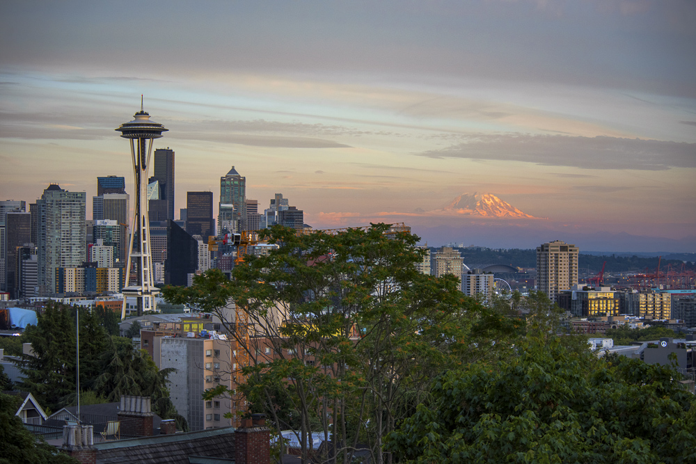 The Seattle skyline and Mount Rainier in alpenglow during a Summer sunset