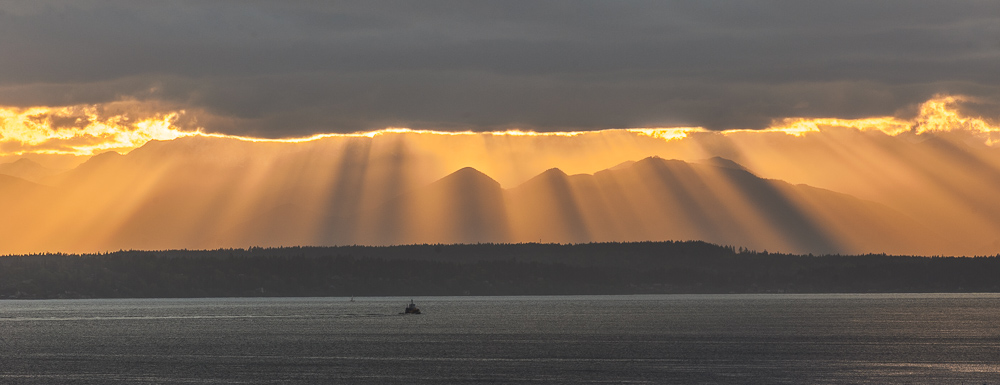 Fingers of God Sunset with the Olympic Mountains peeking through across the Puget Sound from Seattle